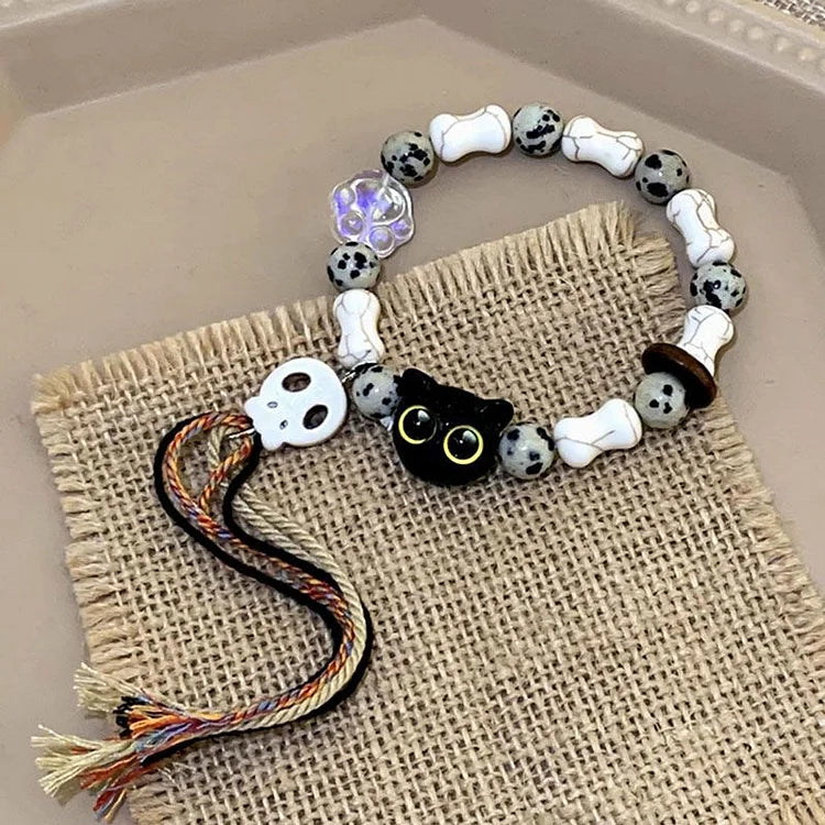 Armband mit Katzen- und Totenkopf-Perlen, weiß-schwarz, handgefertigt, Schmuck, Geschenkidee.