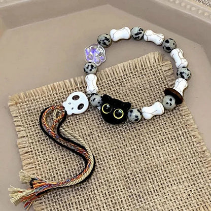 Armband mit Katzen- und Totenkopf-Perlen, weiß-schwarz, handgefertigt, Schmuck, Geschenkidee.
