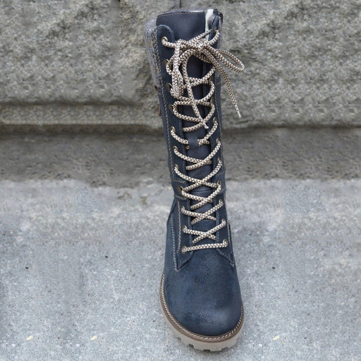 Damenstiefel aus Leder, dunkelblau, mit Schnürung, rutschfeste Sohle, modisch und robust.