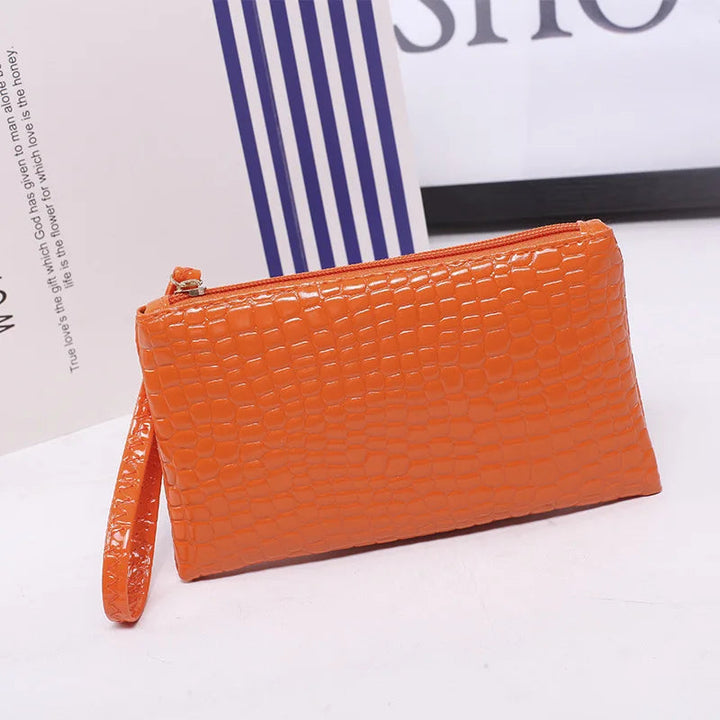 Orangefarbene Clutch aus Krokodillederimitat mit Reißverschluss, modische Damenhandtasche.