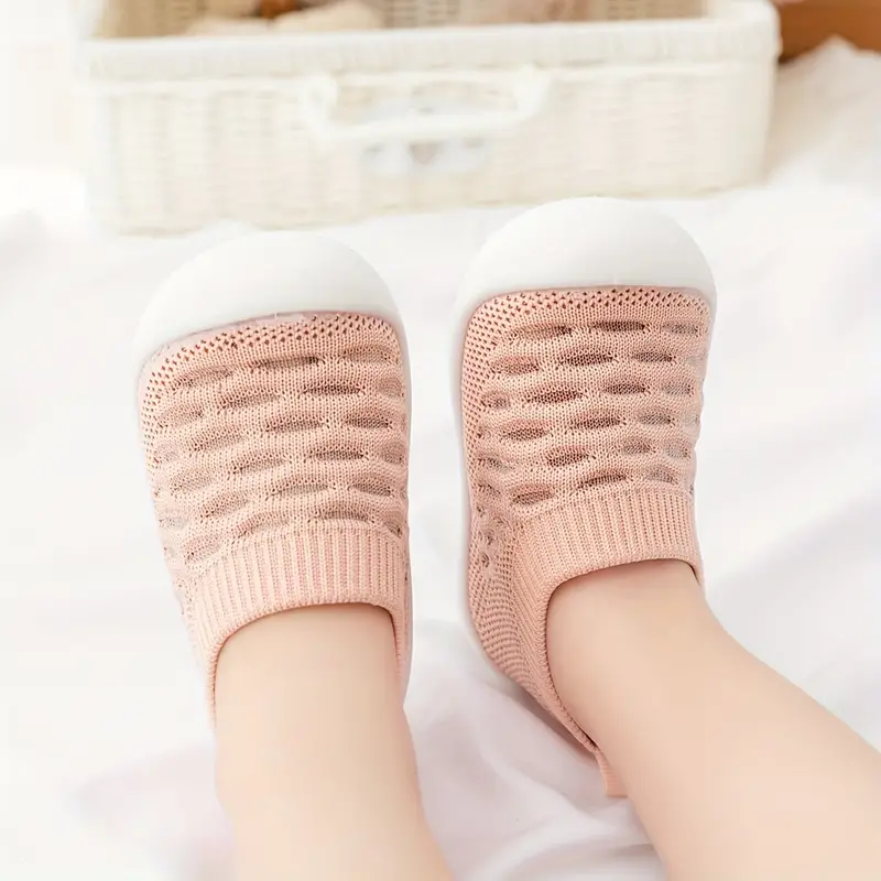 Kleinkind Füßlinge rosa, atmungsaktiv, rutschfest, Strickmaterial, Baby-Schuhe, bequem.