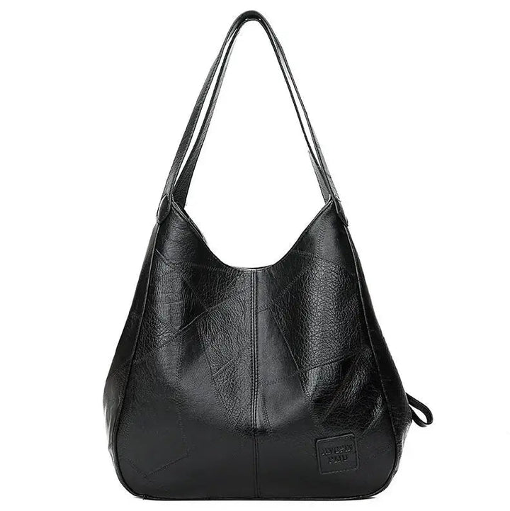 Schwarze Lederhandtasche für Damen, geräumig, modisch, mit langen Trägern, elegant.