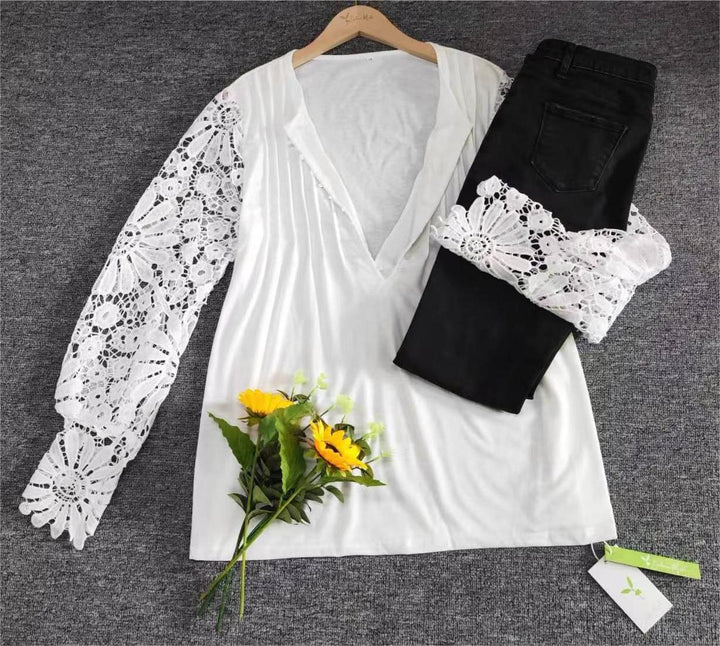 Weiße Bluse mit Spitzenärmeln, schwarze Jeans, Sonnenblumenstrauß, Damenmode Outfit.