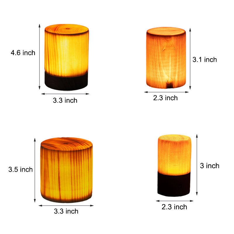 Vier zylindrische LED-Holzlampen, verschiedene Größen, warmes Licht, dekorative Beleuchtung.