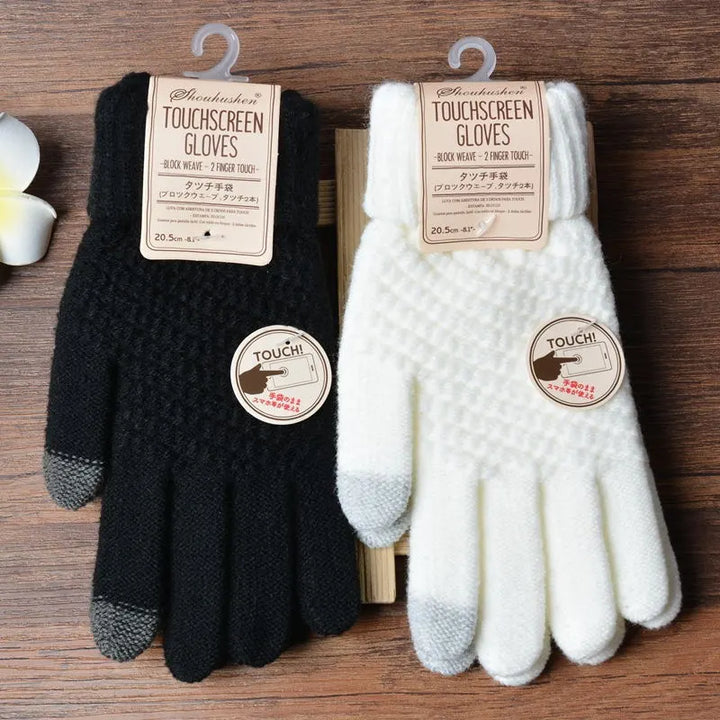 Schwarze und weiße Touchscreen-Handschuhe, gestrickt, für Smartphones geeignet.