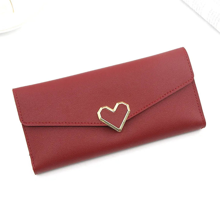 Rote Damen-Geldbörse aus Leder mit Herzverschluss, elegantes Design, modisches Accessoire.