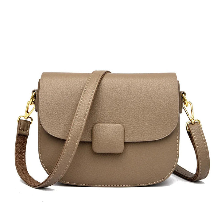 Beige Umhängetasche Damen Leder, modisch, verstellbarer Riemen, goldene Schnallen.