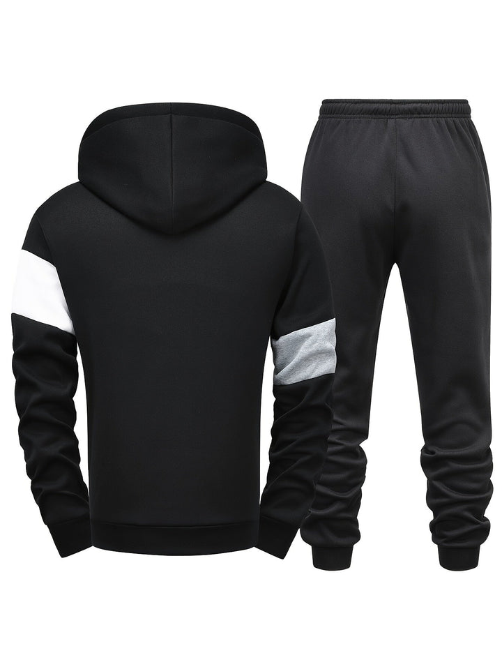 Schwarzer Herren-Trainingsanzug mit Kapuze, weiß-grauen Ärmeln, Jogginghose, Sportbekleidung.