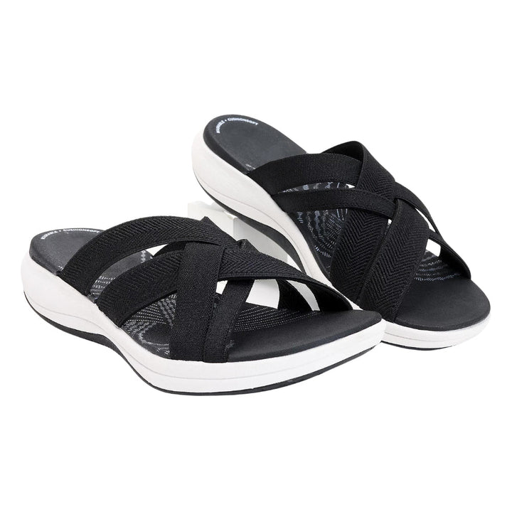 Schwarze Damen-Sandalen mit Kreuzriemen, bequeme Sohle, ideal für Sommermode.