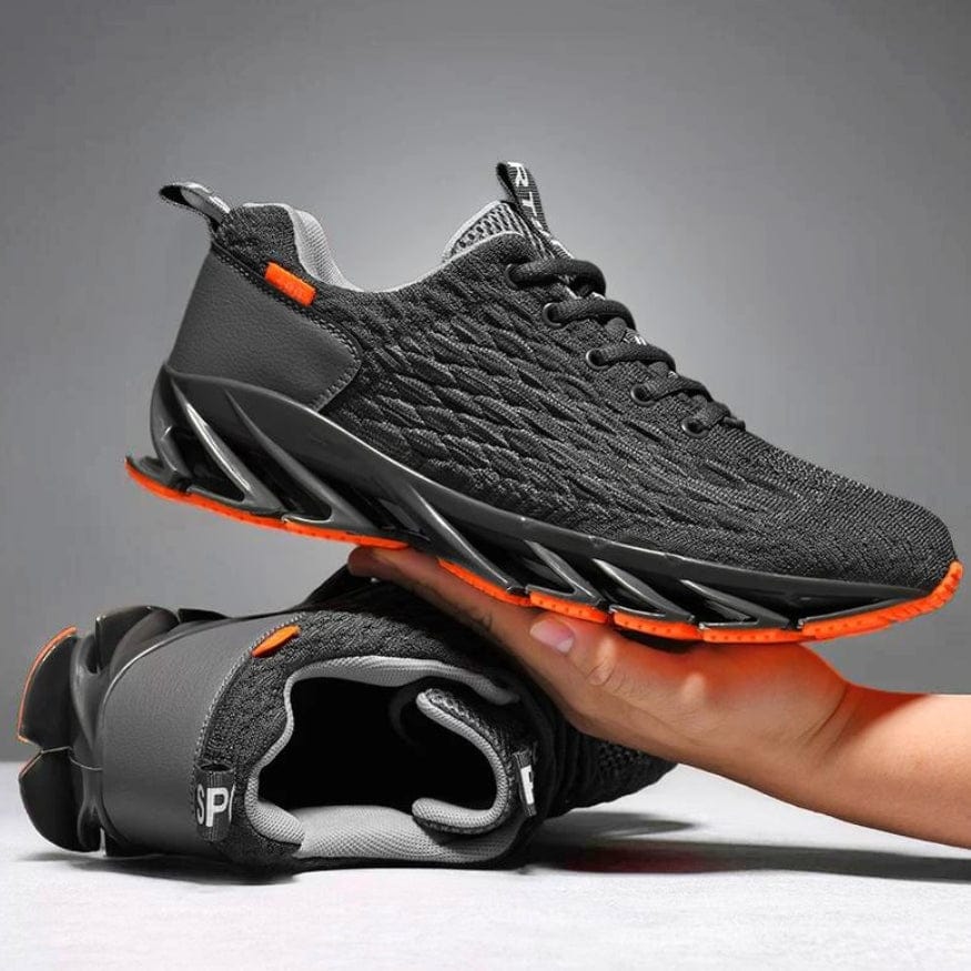 Schwarze Sportschuhe mit oranger Sohle, atmungsaktiv, rutschfest, ideal für Laufen und Fitness.