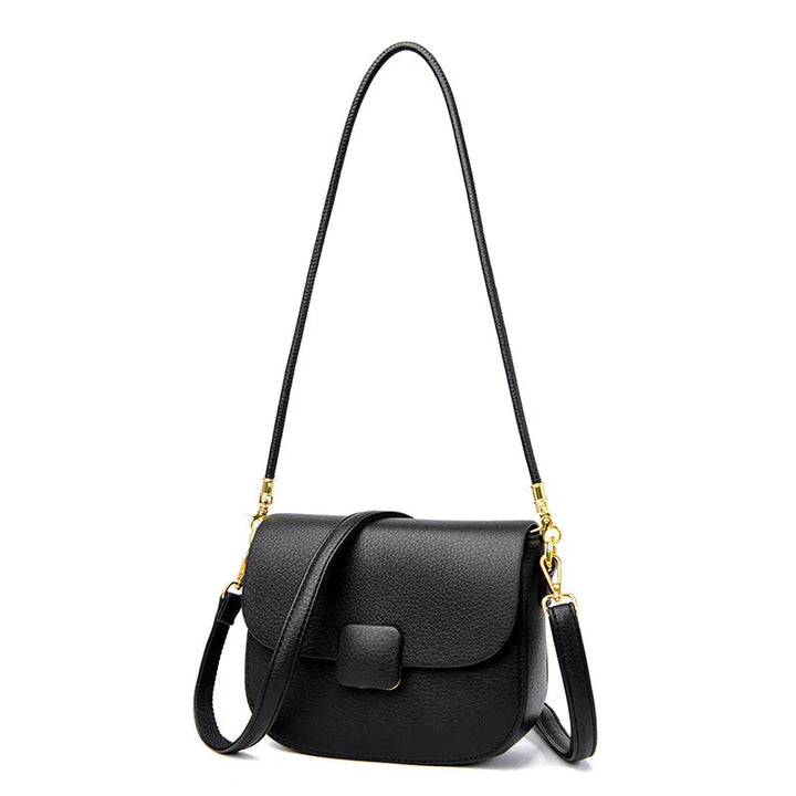 Schwarze Leder-Umhängetasche mit goldenen Details, elegante Damenhandtasche.