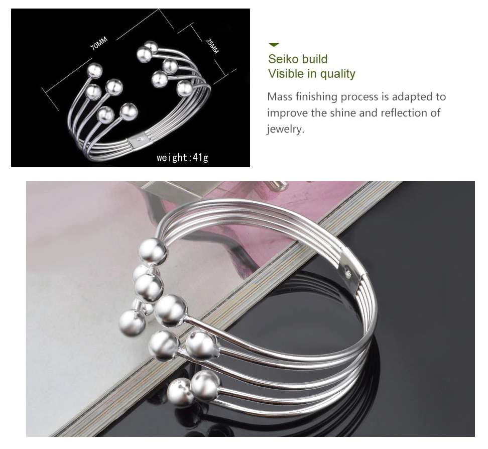 Silberarmreif mit Kugeln, modernes Design, Edelstahl, glänzend, Schmuck für Damen.