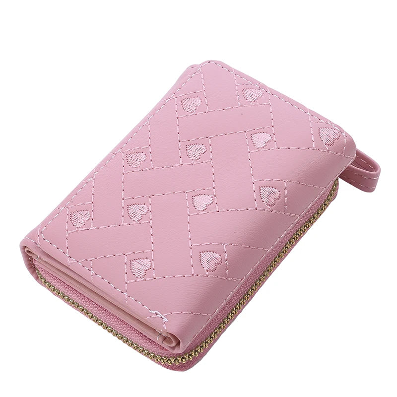 Rosa Damen-Geldbörse aus Leder mit Reißverschluss, stilvolles Design, kompakt und elegant.