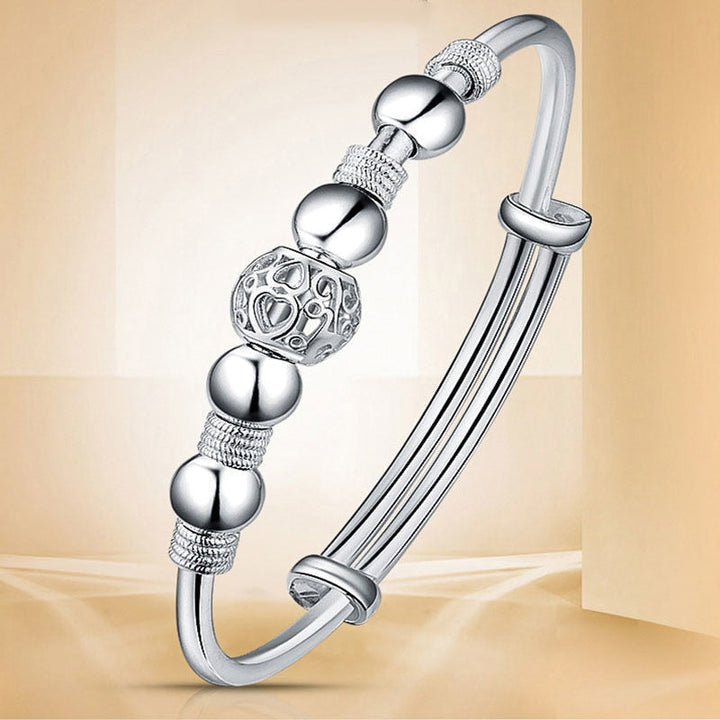 Silberarmband mit Kugel- und Musterdesign, eleganter Schmuck, Damenaccessoire, Geschenkidee.