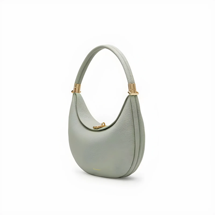 Elegante 4-in-1 Handtasche, hellgraues Leder, goldene Details, vielseitig und hochwertig.