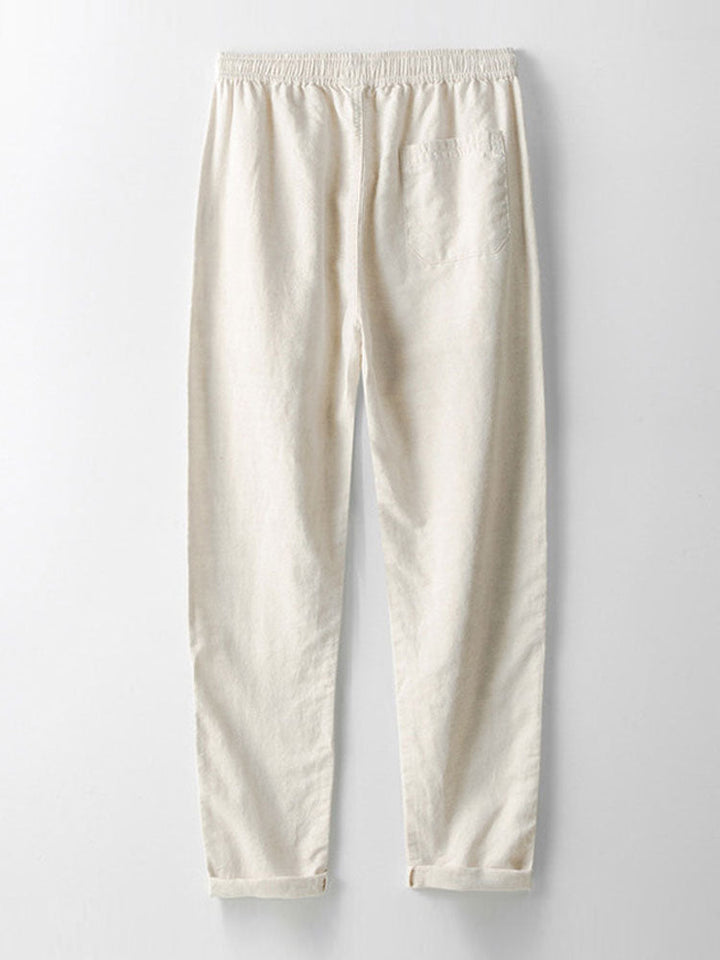 Beige Leinenhose für Damen, elastischer Bund, lässiger Stil, ideal für Sommermode.
