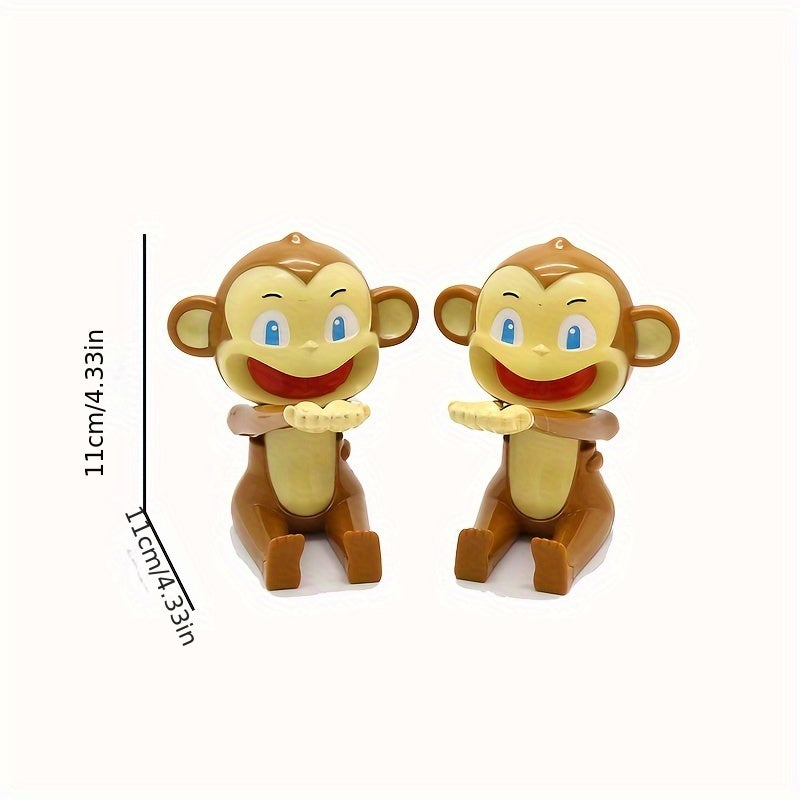 Zwei braune Affen-Spielzeugfiguren, sitzend, 11 cm hoch, mit blauen Augen und roten Mündern.