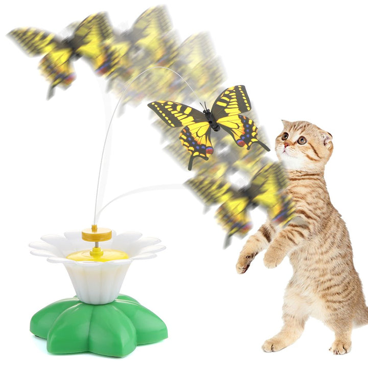 Spielzeug für Katzen mit flatterndem Schmetterling, interaktiv, gelb-schwarz, auf grünem Sockel.
