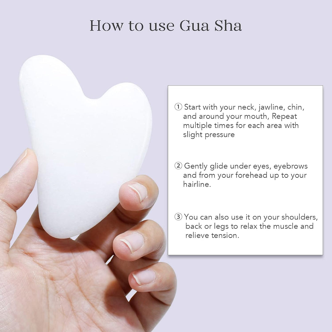 Weiße Gua Sha Gesichtsmassage Stein, herzförmig, für Hautpflege und Entspannung.