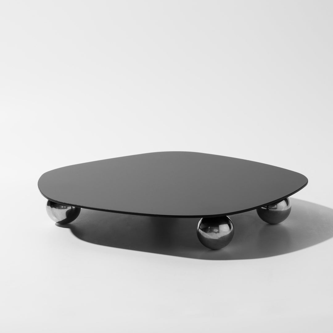 Schwarzer Couchtisch mit runder Platte und kugelförmigen Beinen, modernes Design, Metall.