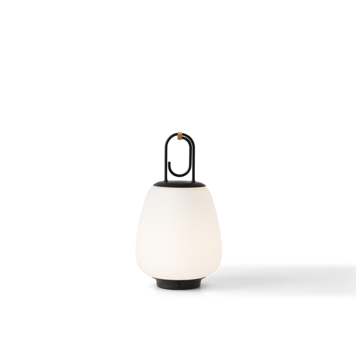 Moderne tragbare LED-Lampe, weiß, mit schwarzem Griff, für Innen- und Außenbeleuchtung.