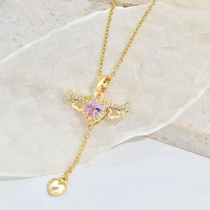 Goldene Halskette mit Herzanhänger, rosa Kristall, Engelsflügel-Design, Damen-Schmuck.