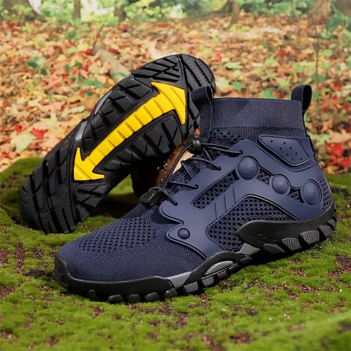 Dunkelblaue Wanderschuhe mit gelber Sohle, atmungsaktiv, rutschfest, ideal für Outdoor-Aktivitäten.
