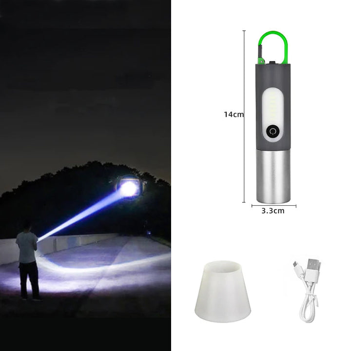 Tragbare LED-Taschenlampe, wiederaufladbar, schwarz-silber, mit USB-Kabel und Lampenschirm.