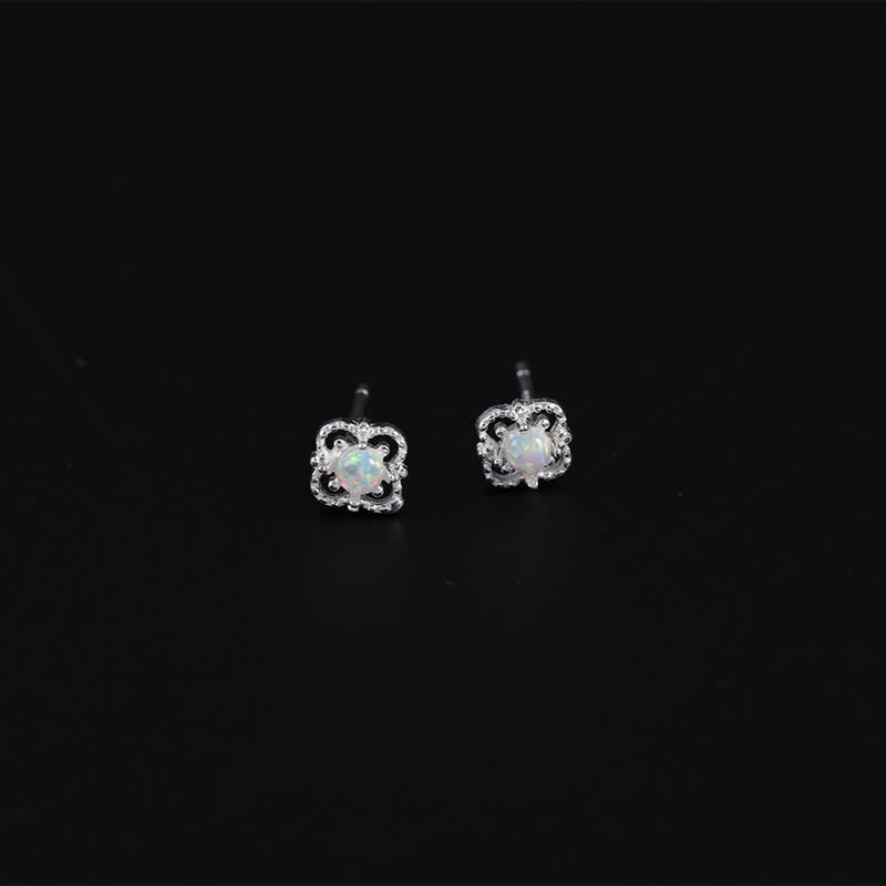 Silberne Opal-Ohrringe, quadratisches Design, eleganter Schmuck, Damenaccessoire.