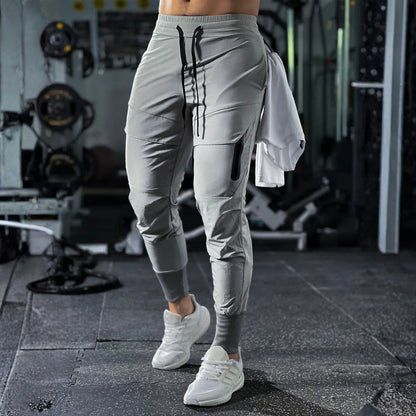 Pánské sportovní kalhoty s elastickým pasem a kapsami – Dario