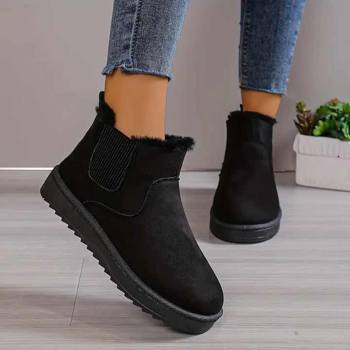Schwarze Damen-Winterstiefel aus Wildleder mit Fellfutter, rutschfeste Sohle, modisch und warm.