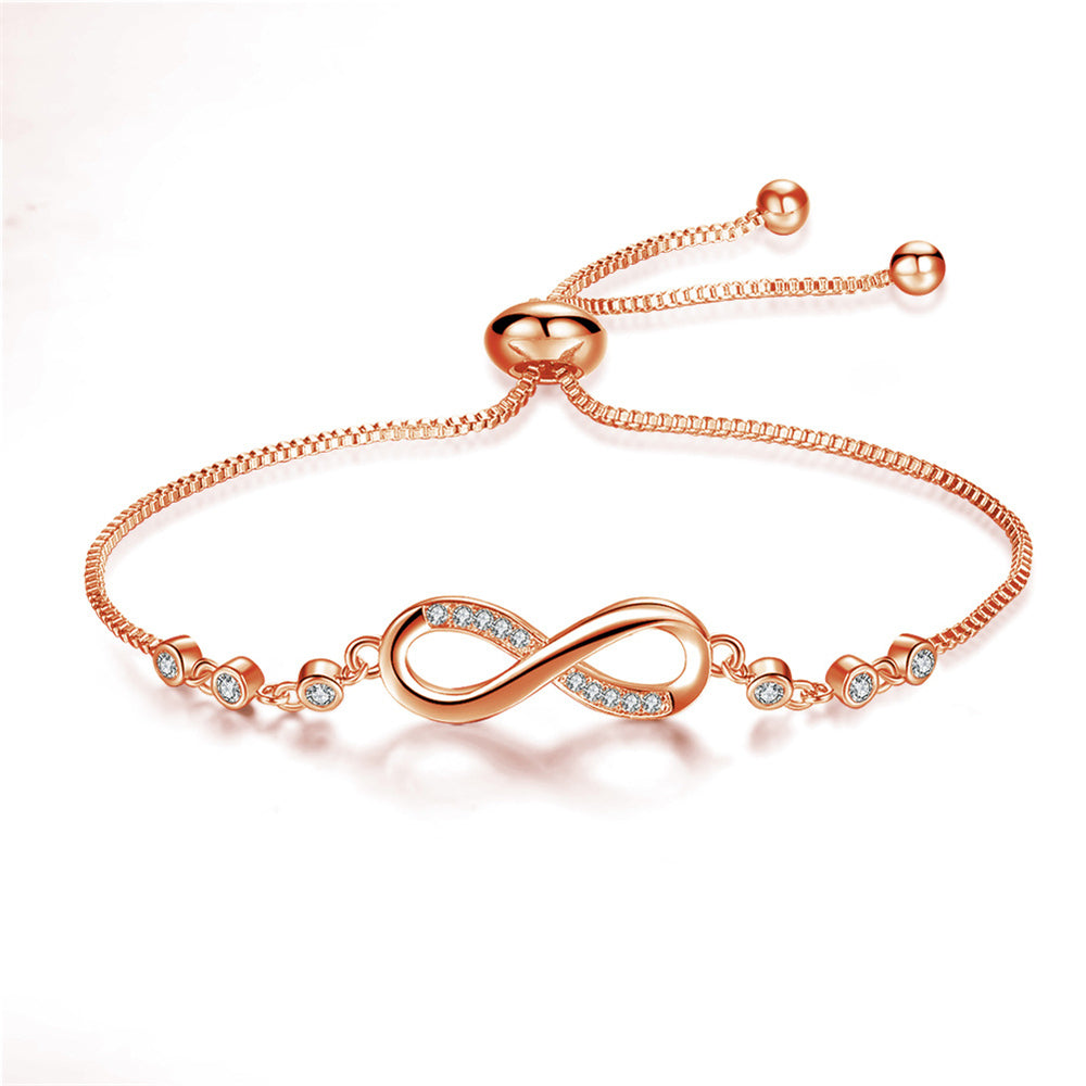 Roségoldenes Armband mit Unendlichkeitssymbol und Zirkonia-Steinen, verstellbar, elegant.