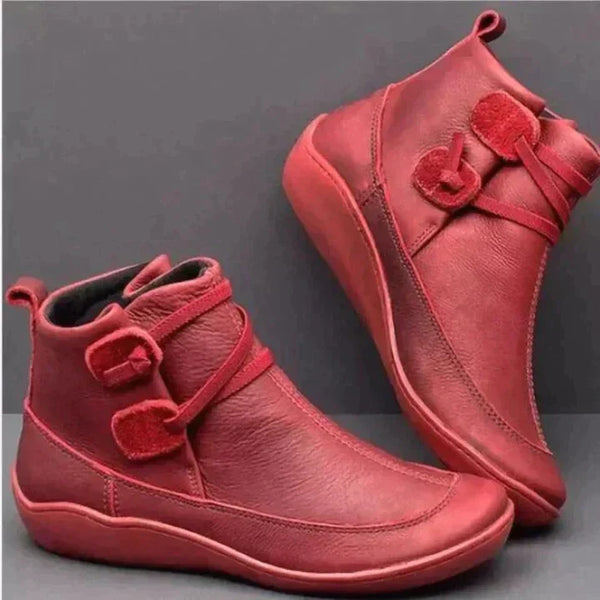 Rote Damenstiefeletten aus Leder mit Klettverschluss, modisch und bequem.