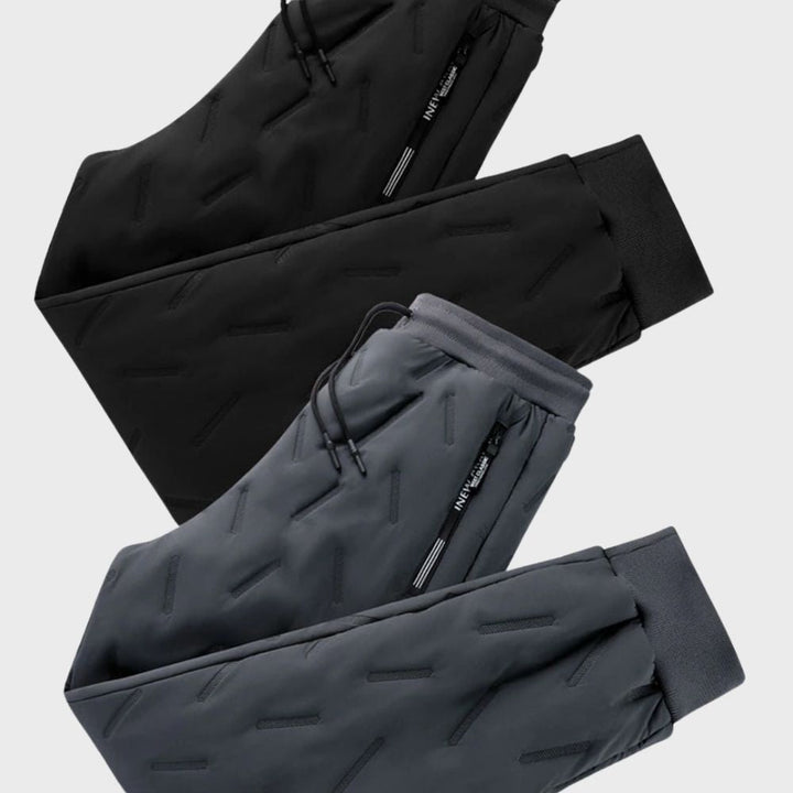 Schwarze und graue Jogginghosen mit Reißverschlusstaschen, sportlich, bequem, Herrenmode.
