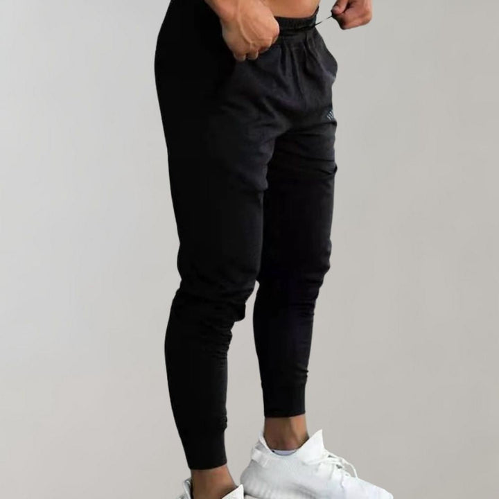 Schwarze Herren-Jogginghose, elastisch, bequem, Sportbekleidung, Fitness, Freizeitmode.