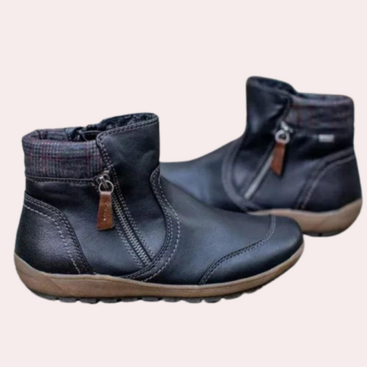 Schwarze Damenstiefeletten mit Reißverschluss, Lederoptik, bequeme Sohle, modisch.