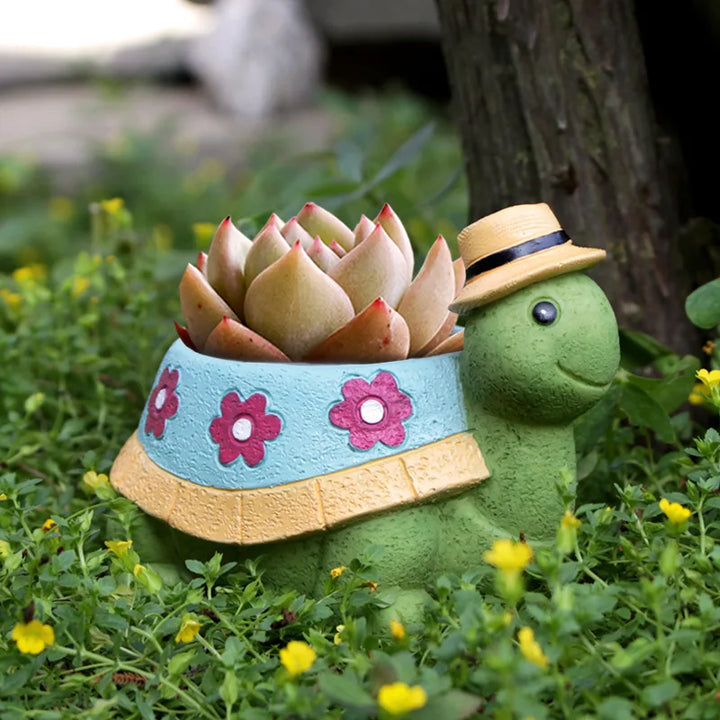 Niedliche Schildkröten-Blumentopf, grün, mit Blumenmuster, ideal für Garten-Dekoration.