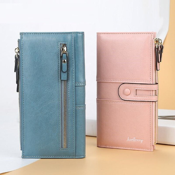 Zwei Damen-Lederportemonnaies mit Doppelreißverschluss, blau und rosa, elegant und stilvoll.