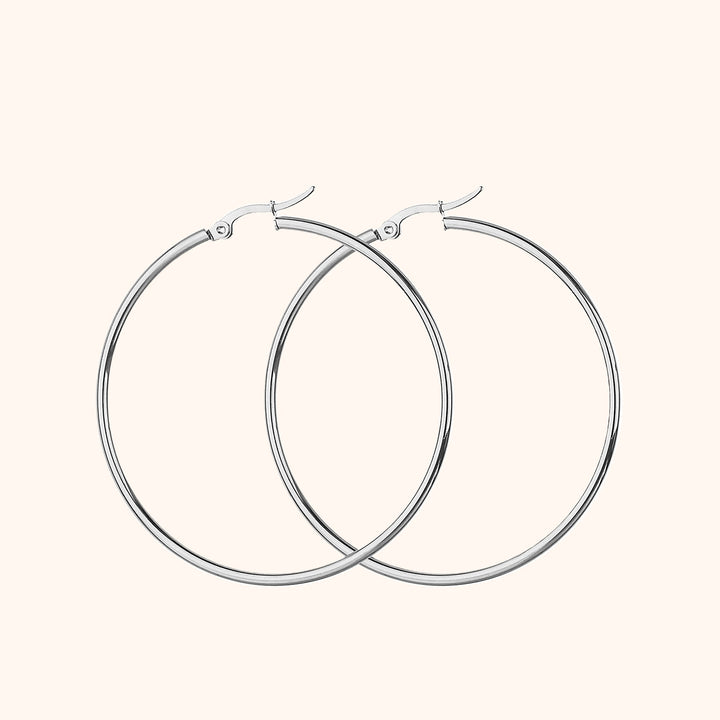 Silberne Creolen Ohrringe, Edelstahl, minimalistisches Design, modischer Schmuck für Damen.