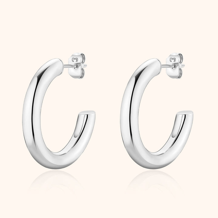 Silberne Creolen Ohrringe, glänzend, Edelstahl, modisch, zeitloses Design, Schmuck für Damen.