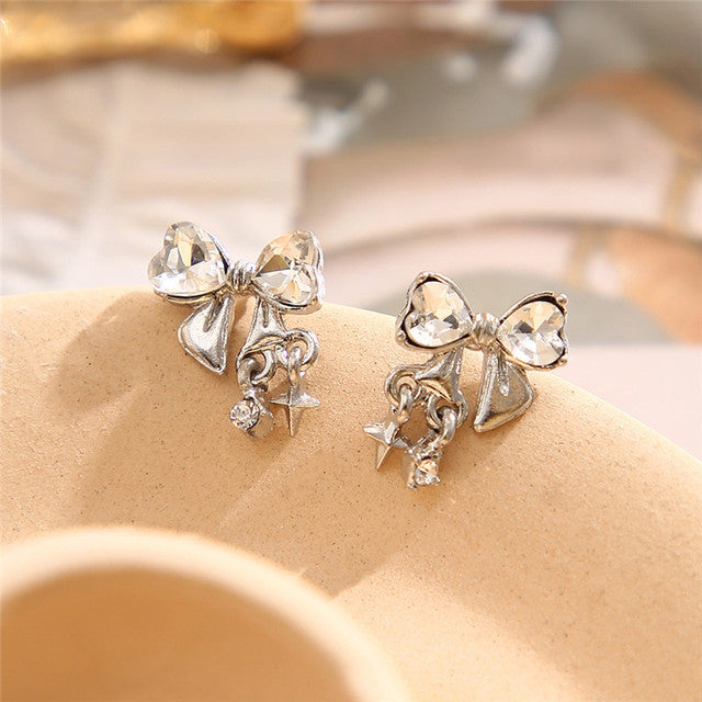 Silberne Ohrringe mit Kristallschleife und Sternanhänger, modisch, elegant, für Damen.
