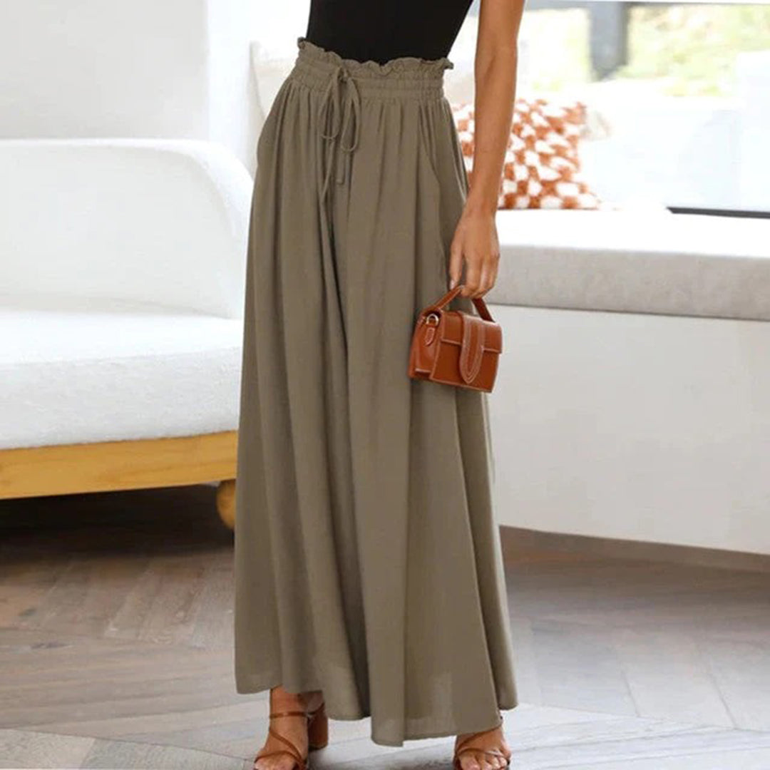 Damenhose, weit geschnitten, olivgrün, mit Kordelzug, elegant, aus leichtem Stoff.