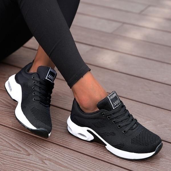 Schwarze Damen-Sneaker, atmungsaktiv, modisch, ideal für Freizeit und Sport.