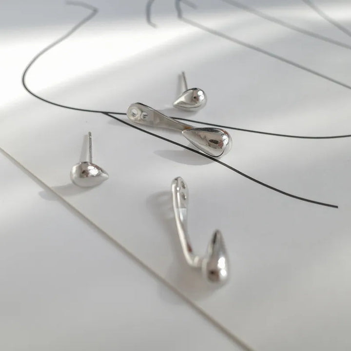 Silberne Ohrringe Set, minimalistisches Design, Tropfenform, Schmuck für Damen, modern.