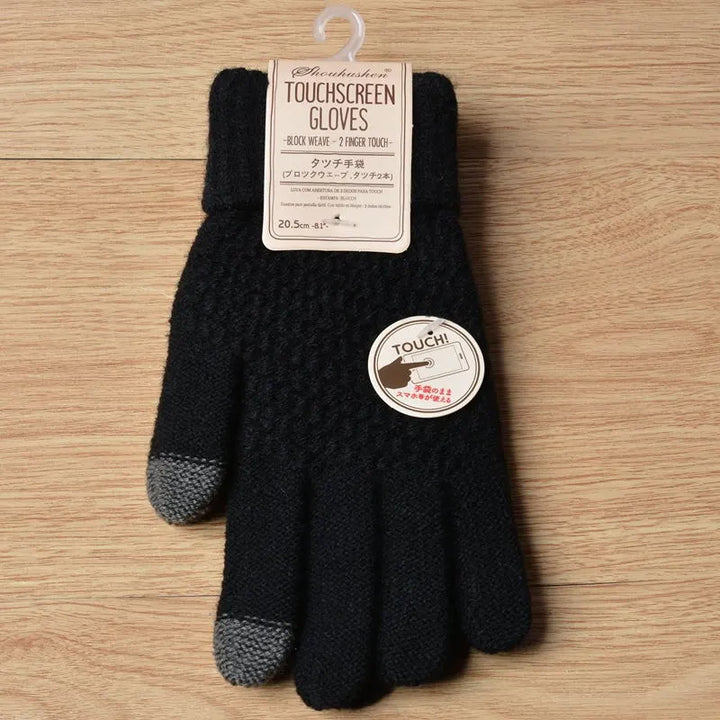 Schwarze Touchscreen-Handschuhe aus Strick mit grauen Fingerspitzen auf Holzuntergrund.