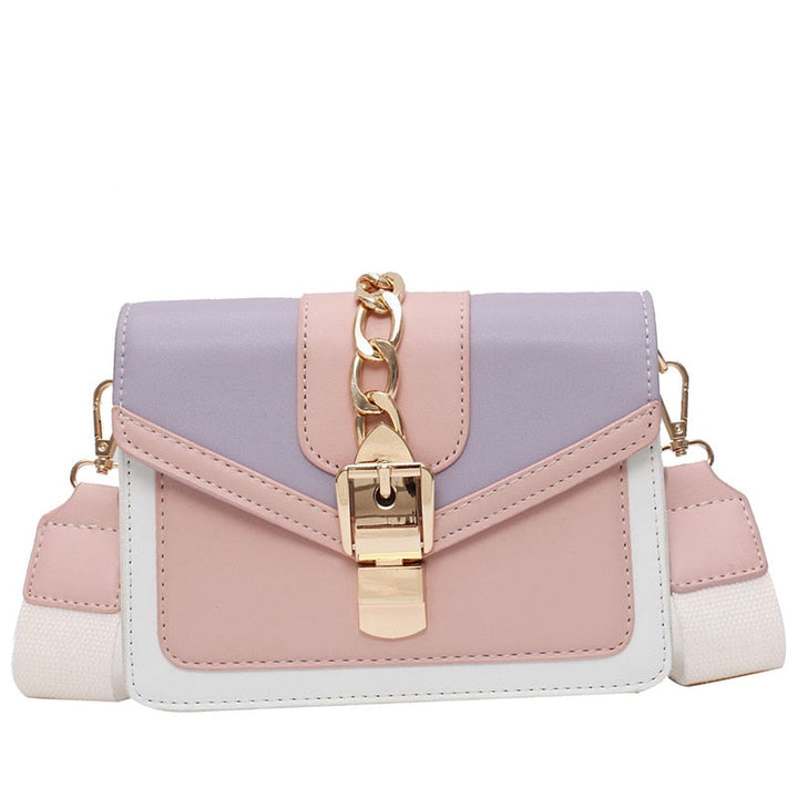 Damenhandtasche aus Kunstleder, rosa-lila, mit goldener Kette und Schnalle, modisch, elegant.