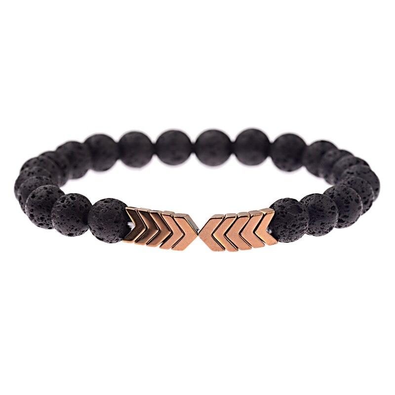 Schwarzes Lavastein-Armband mit goldenen Pfeil-Details, elastisch, Unisex-Schmuck.