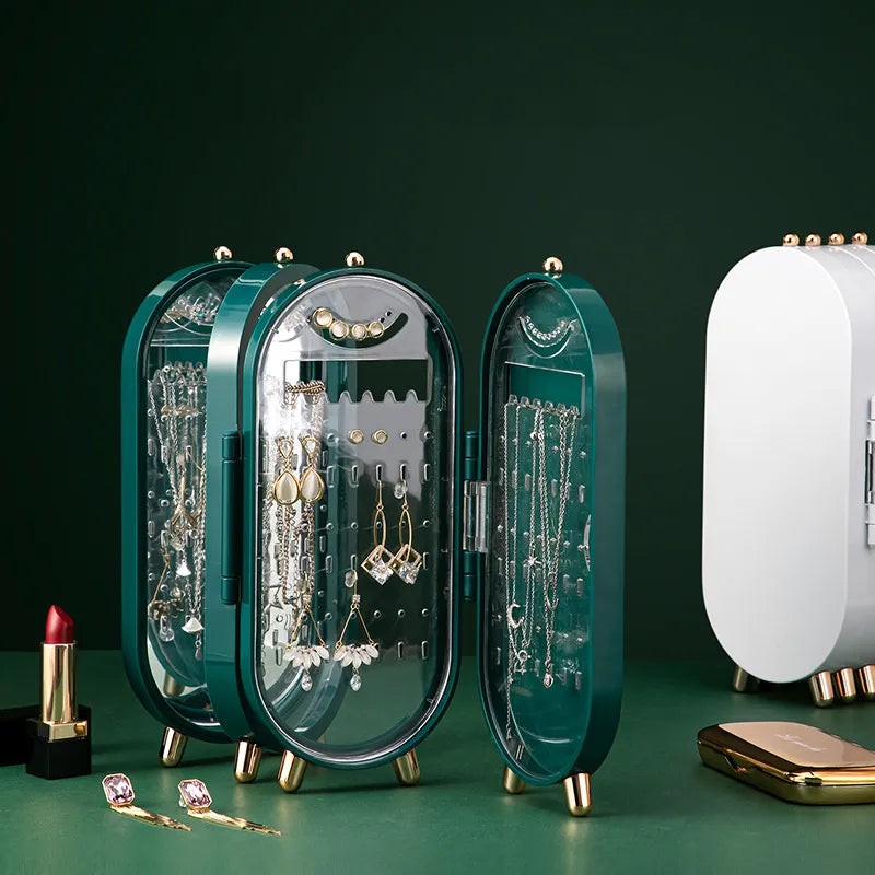 Grüner Schmuck-Organizer mit transparenten Türen, ideal zur Aufbewahrung von Ohrringen und Ketten.