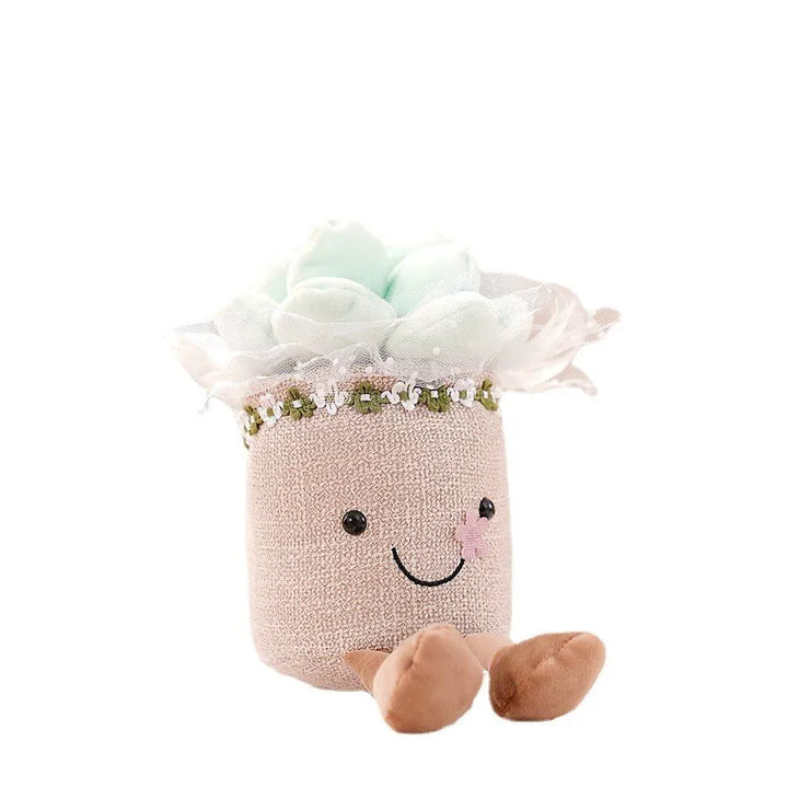 Kuscheltier Blumentopf, beige, mit lächelndem Gesicht und cyanfarbenen Stoffblumen.