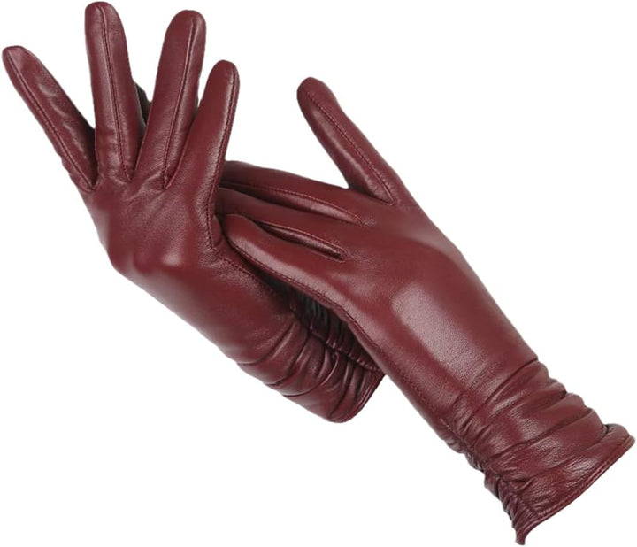 Damenhandschuhe aus rotem Leder, elegant, warm, Wintermode, Accessoire, stilvoll.
